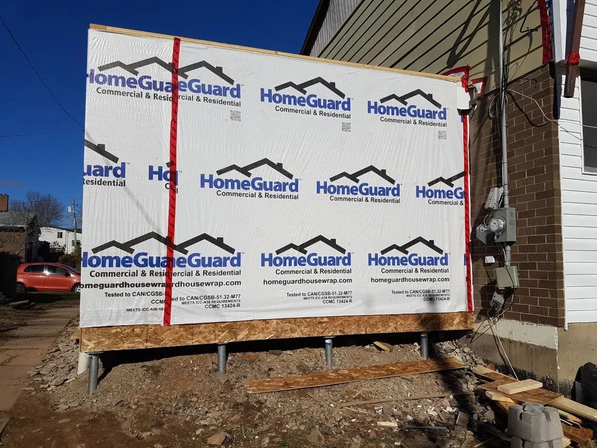 Ground screws supporting a home addition