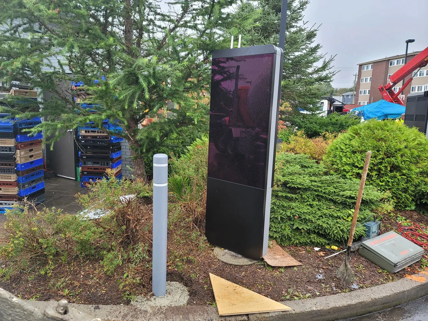 Commercial digital sign mounted on a ground screw base